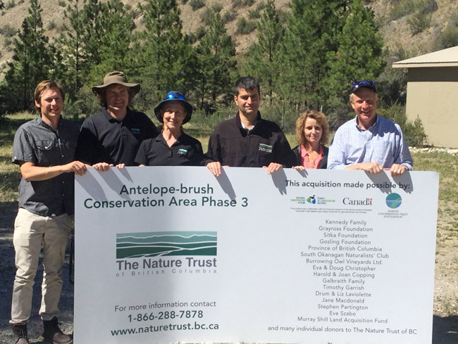Staff from The Nature Trust of BC celebrate the acquisition of the Antelope Brush property last June. An HCTF acquisition grant was used to help purchase this property. 