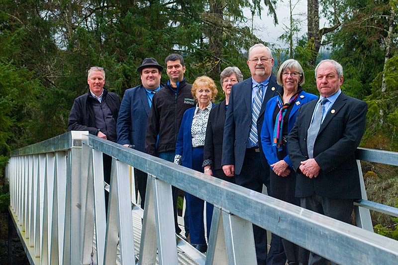 Lieutenant Governor Judy Guichon (second from right), HCTF CEO Brian Springinotic (far left), and The Nature Trust CEO Jasper Lament (third from left) celebrate the opening of a footbridge to the newest addition to the Salmon River Estuary Conservation Area. HCTF provided an acquisition grant to The Nature Trust of BC in 2015 to purchase the property.